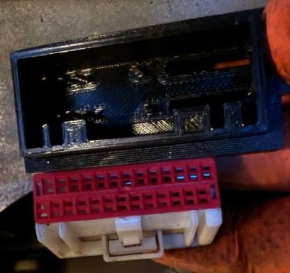 The white and red car connector beside the JagBT Vision connector